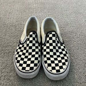 Black and white checkered Vans, size 8.5 womens and 7 men’s.